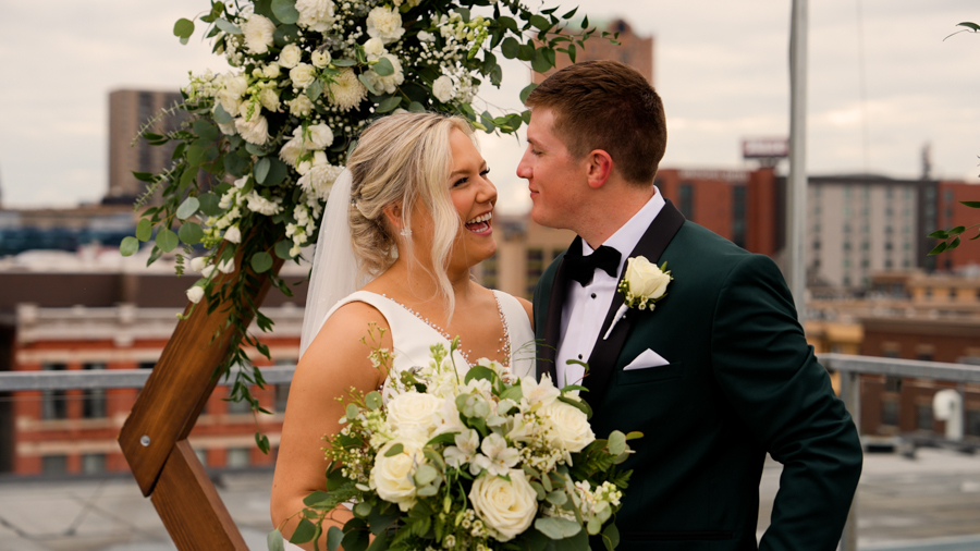 a man and woman smiling at each other